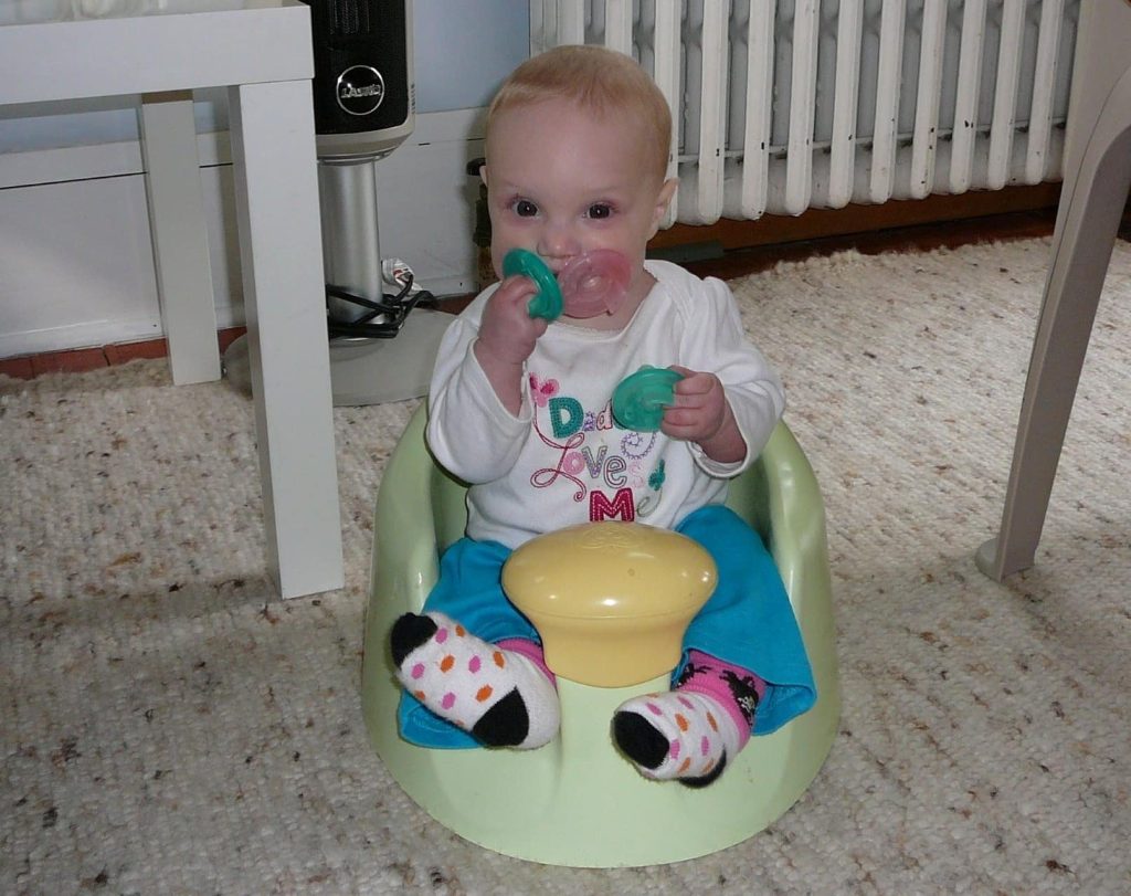 Madeleine loves her pacifiers